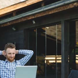 Handsome businessman working with laptop