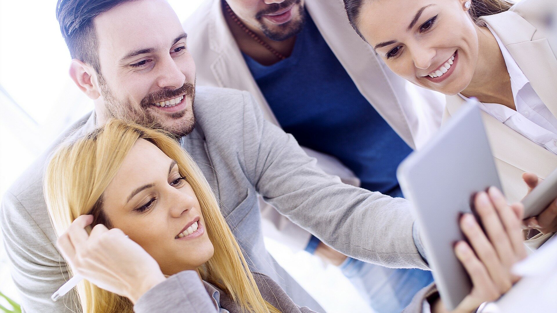 Business people using digital tablet at meeting